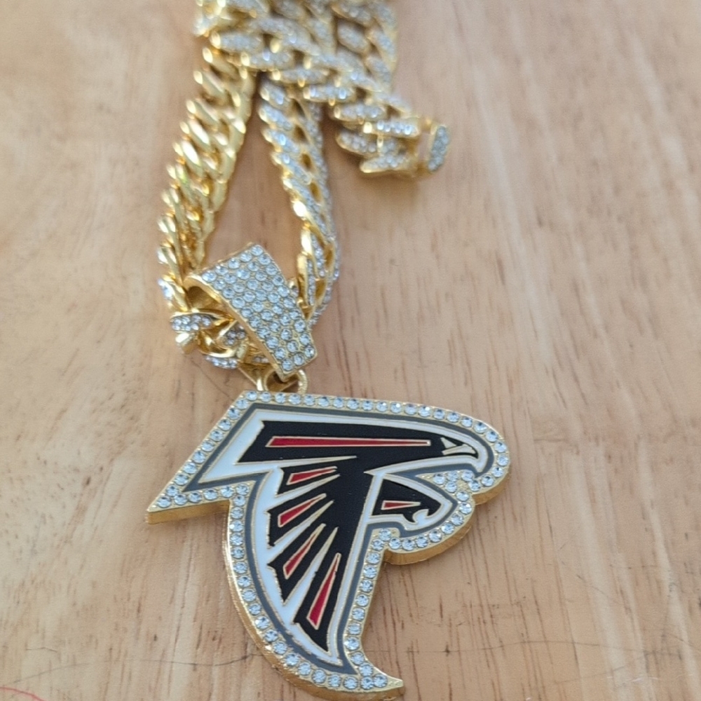 Unk Gold-Tone Falcon Logo Pendant Necklace with Black and Red Enamel